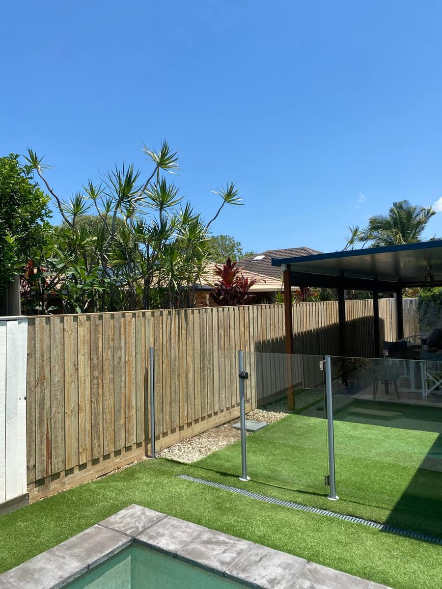 Lapped and capped timber fence with sleepers